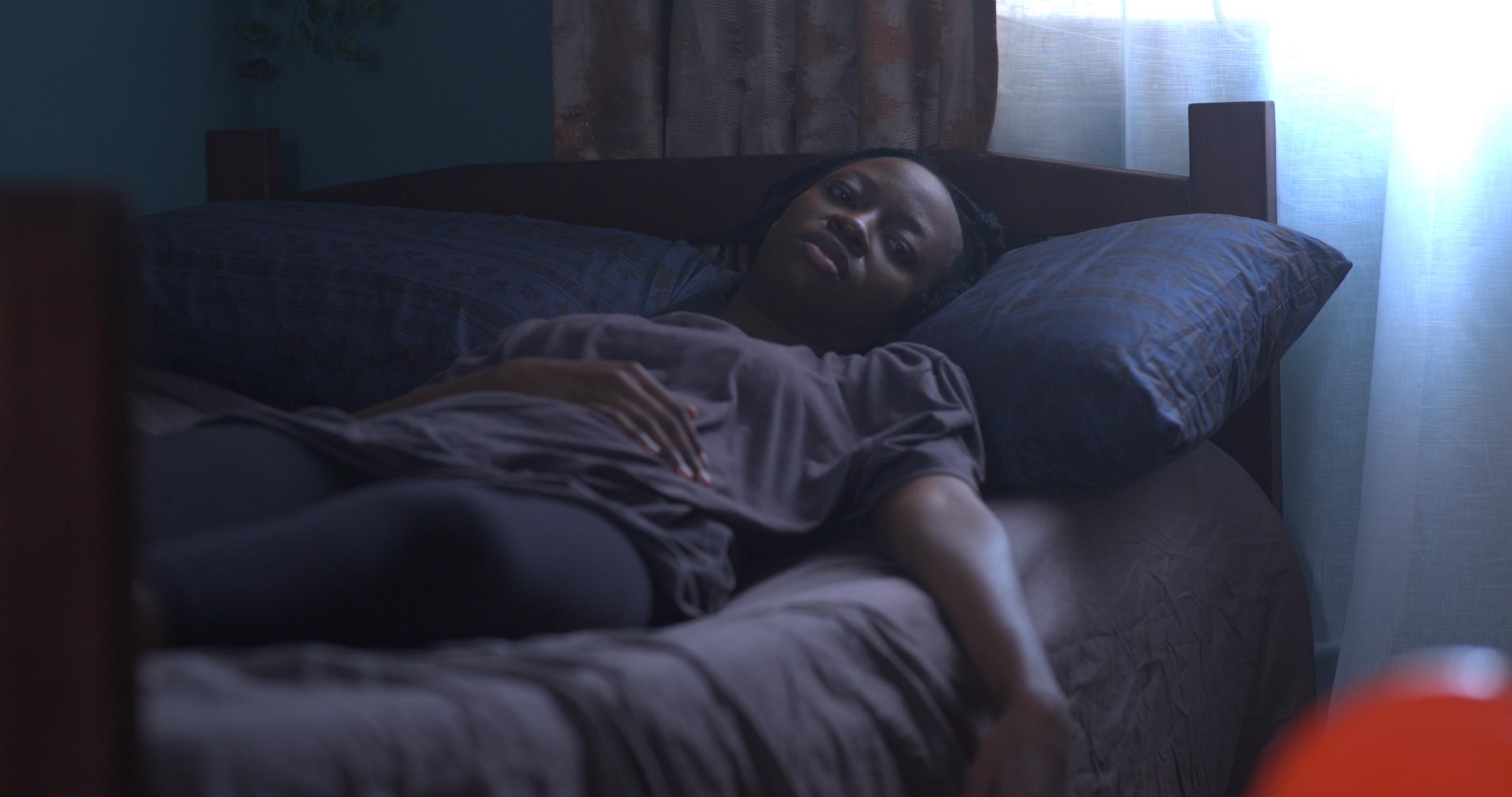 'Ireti' by Temi Ami-Williams Brings a Powerful Tale of Resilience and Community to AFRIFF 2024 5 Iyanu Kanyin Eros in bed