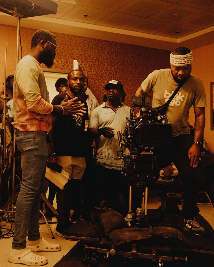 'At Ease:' Seun Richards' Journey from Military Aspirations to Mental Health Awareness in Nollywood 3 Seun Richards with crew members on the set of 'At Ease' © First Features Project