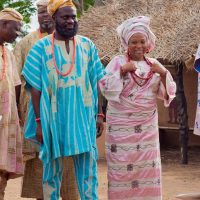 Nosa Afolabi (Lasisi Elenu) with others on the set of 'Asiri Ade' - © Papaya Studios